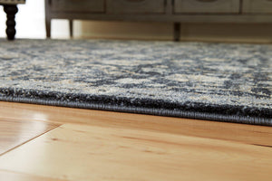 Hilcott 7'10" x 10'6" Rug - 46 Furniture and Mattress Gallery