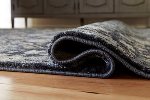 Hilcott 7'10" x 10'6" Rug - 46 Furniture and Mattress Gallery